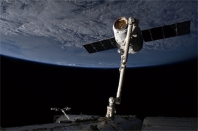 Photo of a Dragon, snared and tamed by Canadarm2