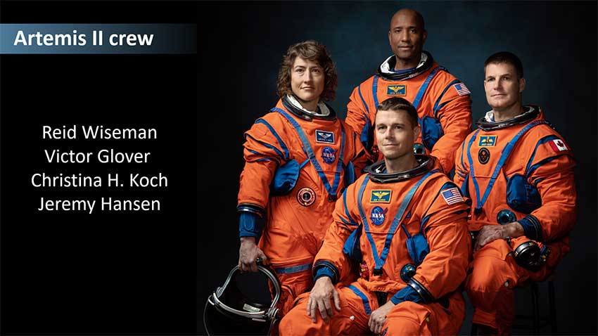 Group photo of the four astronauts assigned to the Artemis II mission. They are all wearing orange space suits