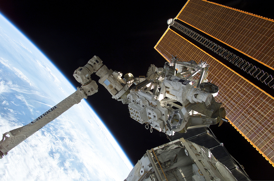 Canadarm2 grapples the Mobile Base System (MBS)