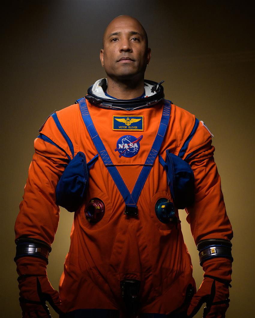 NASA astronaut Victor Glover poses in his Artemis flight suit