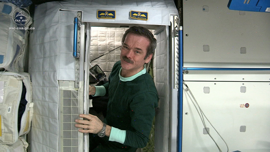 Chris Hadfield wearing his space jammies aboard the ISS