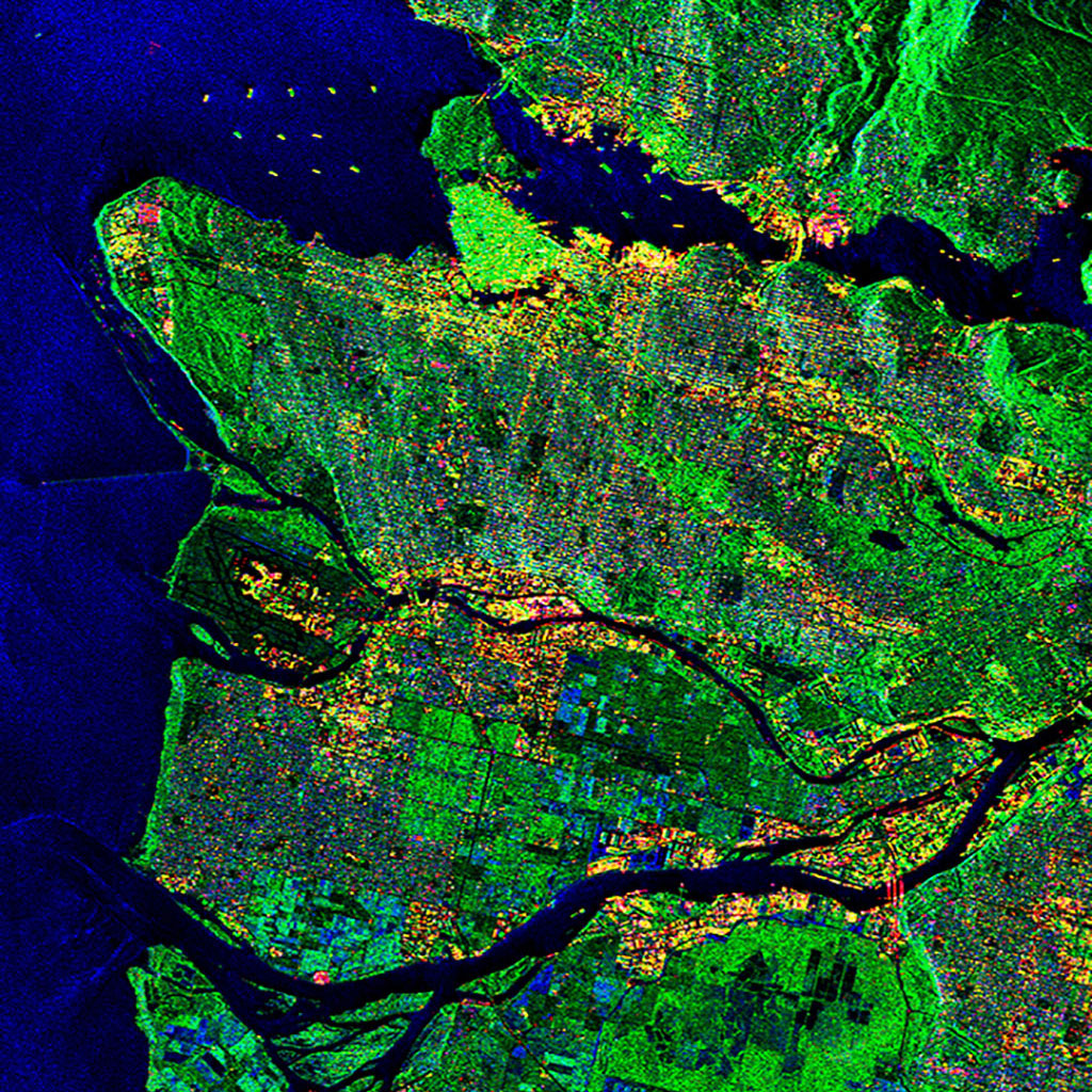 Des navires sont visibles dans le haut de cette image de Vancouver acquise par le satellite canadien RADARSAT-2. On y voit aussi l'aéroport de Vancouver. (Source : Données et produits de RADARSAT-2 © MacDonald, Dettwiler and Associates Ltd (2011) - Tous droits réservés – RADARSAT est une marque officielle de l'Agence spatiale canadienne.)