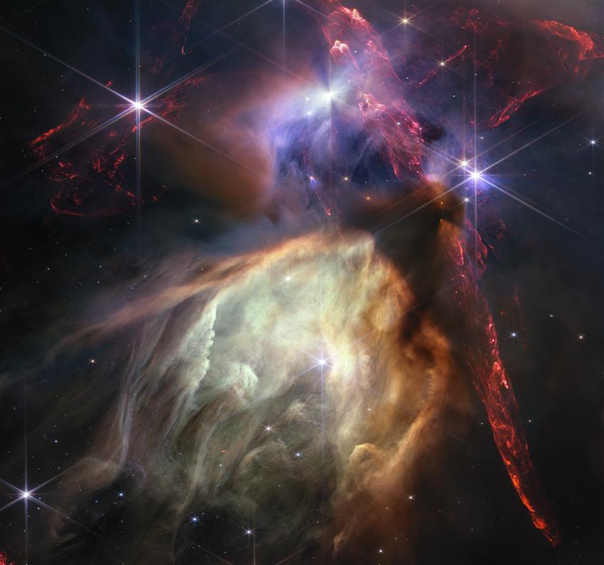 Des jets projetés par les jeunes étoiles illuminent des gaz interstellaires environnants de cette pouponnière d'étoiles.