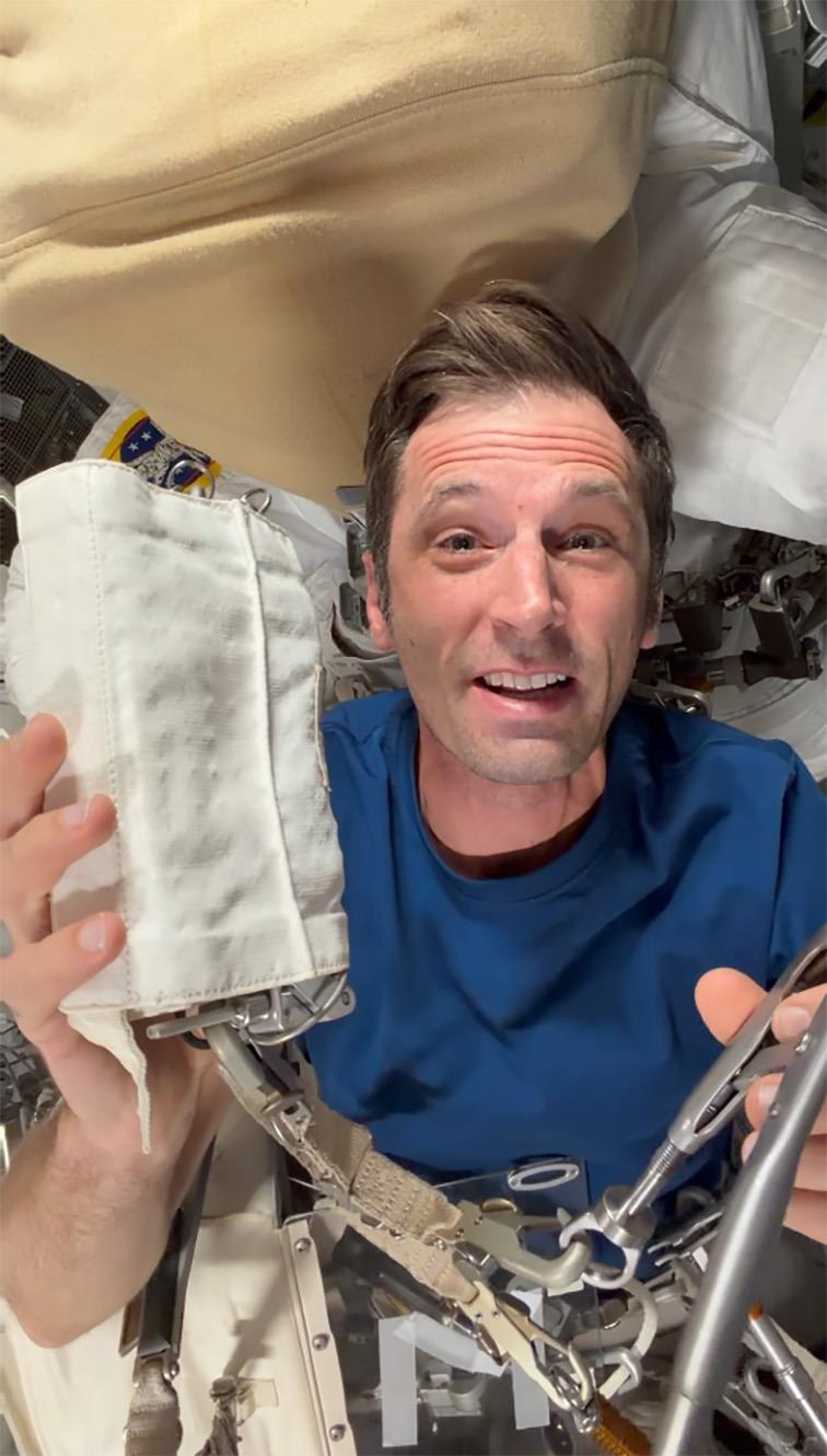 Joshua holds one of the tools that will be used during his first spacewalk.