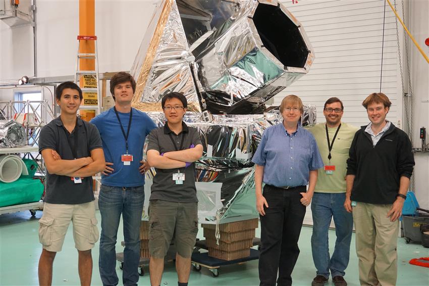 University students pose in front of their BIT telescope