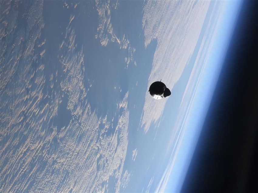 The spacecraft above Earth, as seen from the International Space Station.