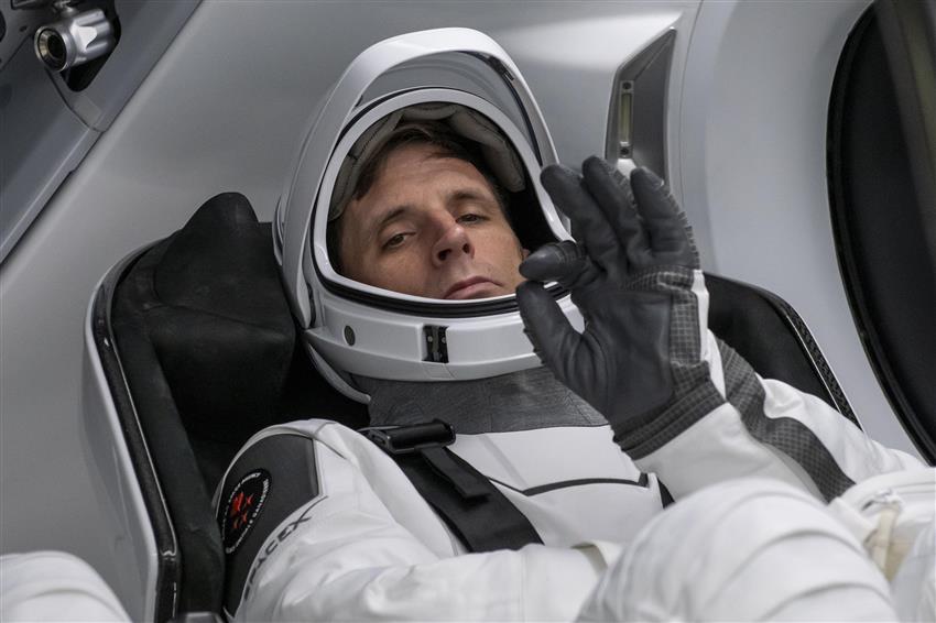 Joshua signals okay from a SpaceX capsule. 