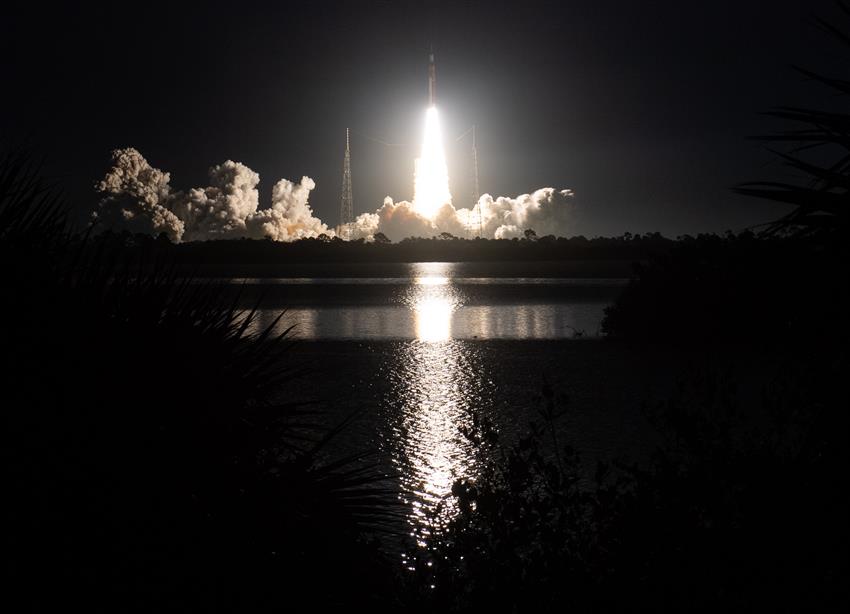 SLS rocket and the Orion spacecraft lifting off
