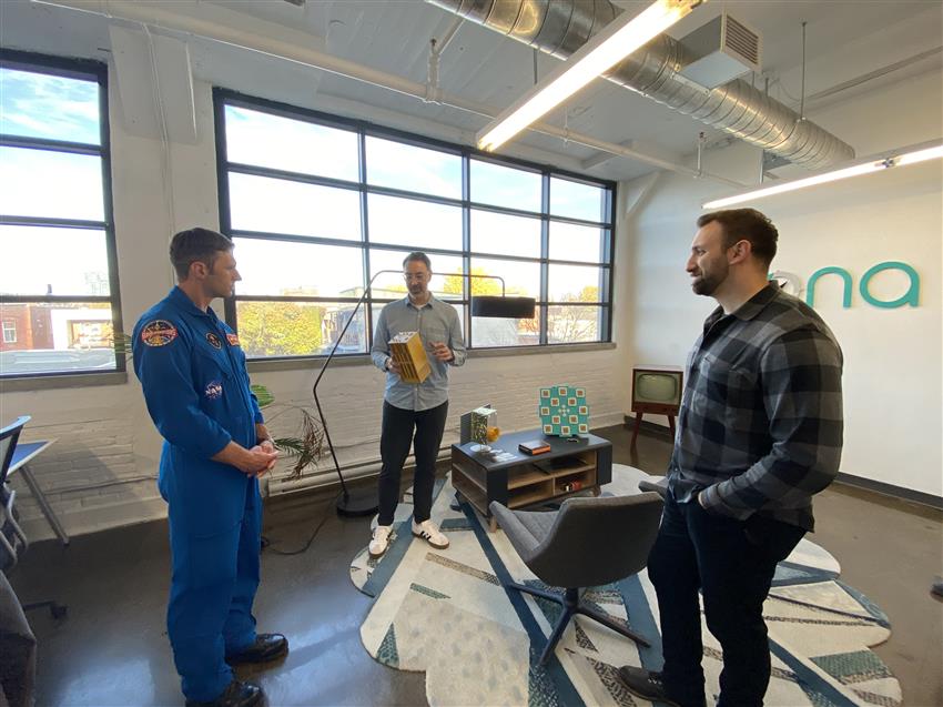 Joshua with two Xona employees. 