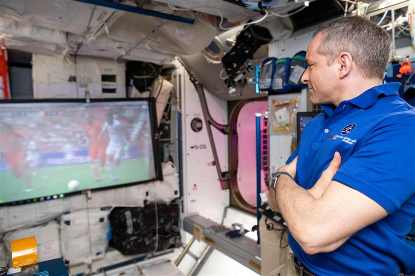 David Saint-Jacques watches women soccer match from the ISS