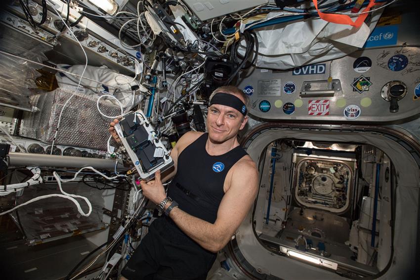 Canadian Space Agency astronaut David Saint-Jacques tries the Bio-Monitor