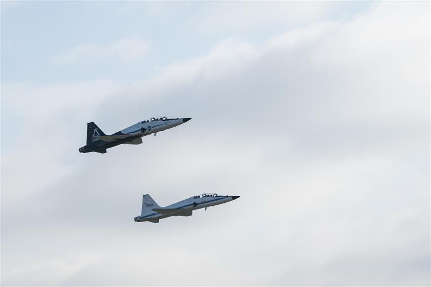 Two airplanes in the sky.