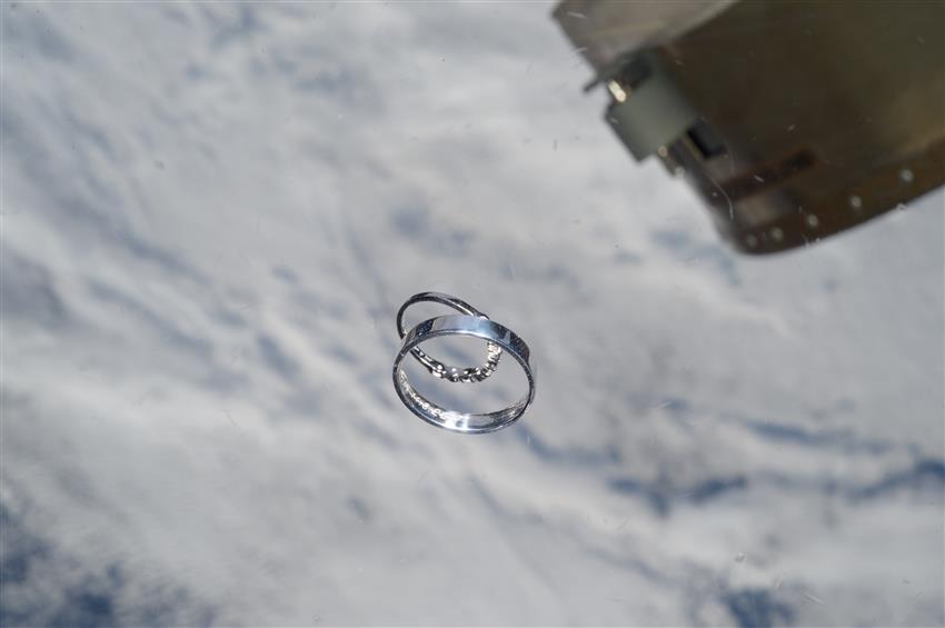 Wedding rings floating in space