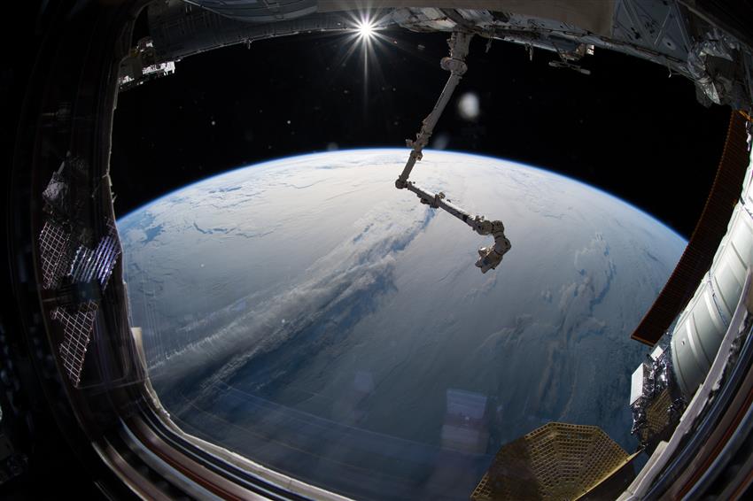 Canadarm2 stretched over Earth