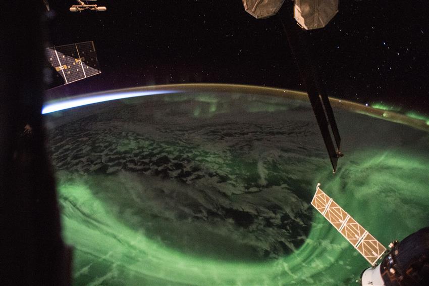 Earth seen from space while a green aurora was covering a large part of the southern hemisphere