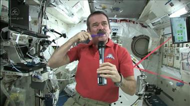 Thumbnail for video: 'Chris Hadfield brushes his teeth in space'